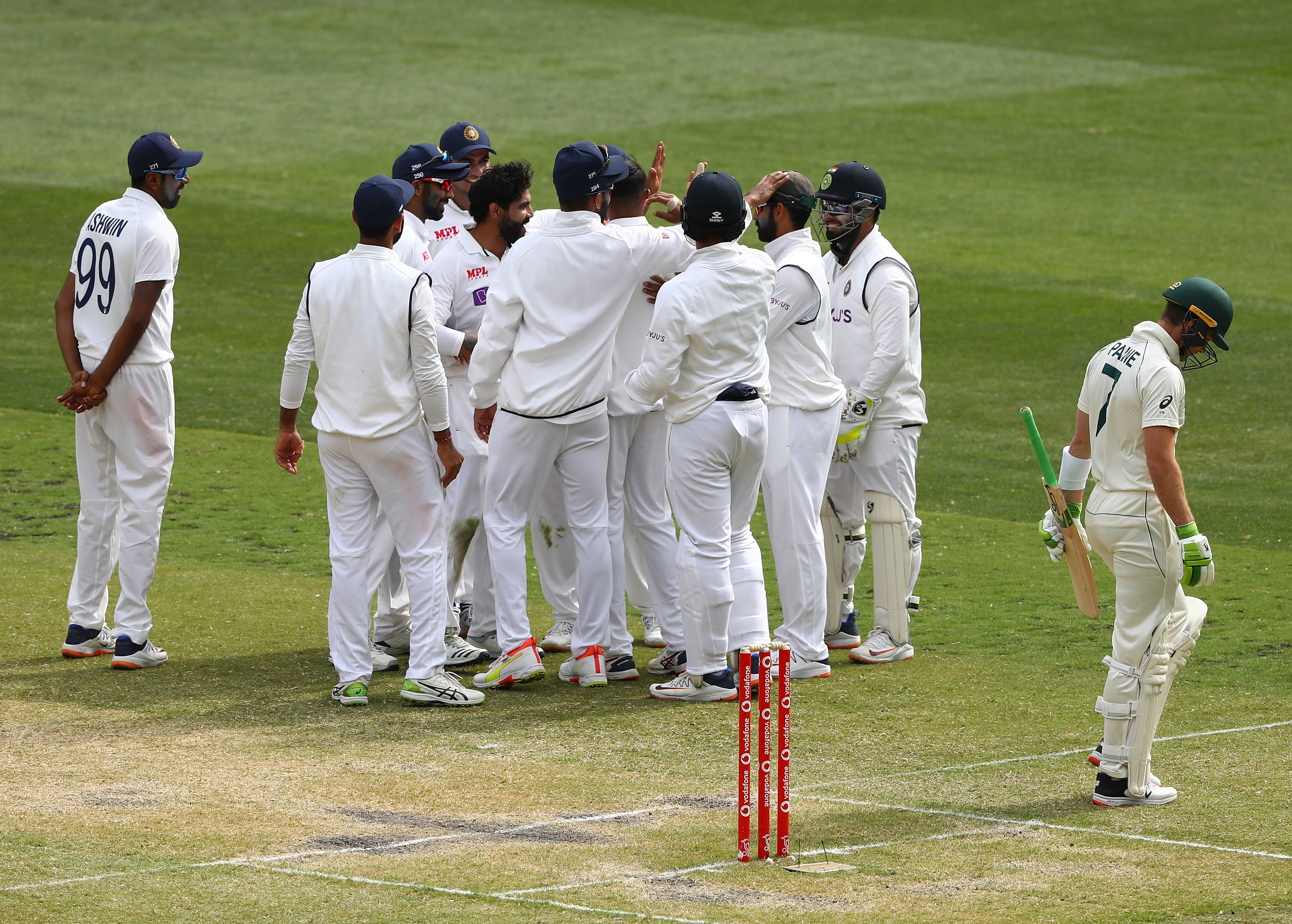 Ashwin looks from a distance as India celebrates Paine dismissal