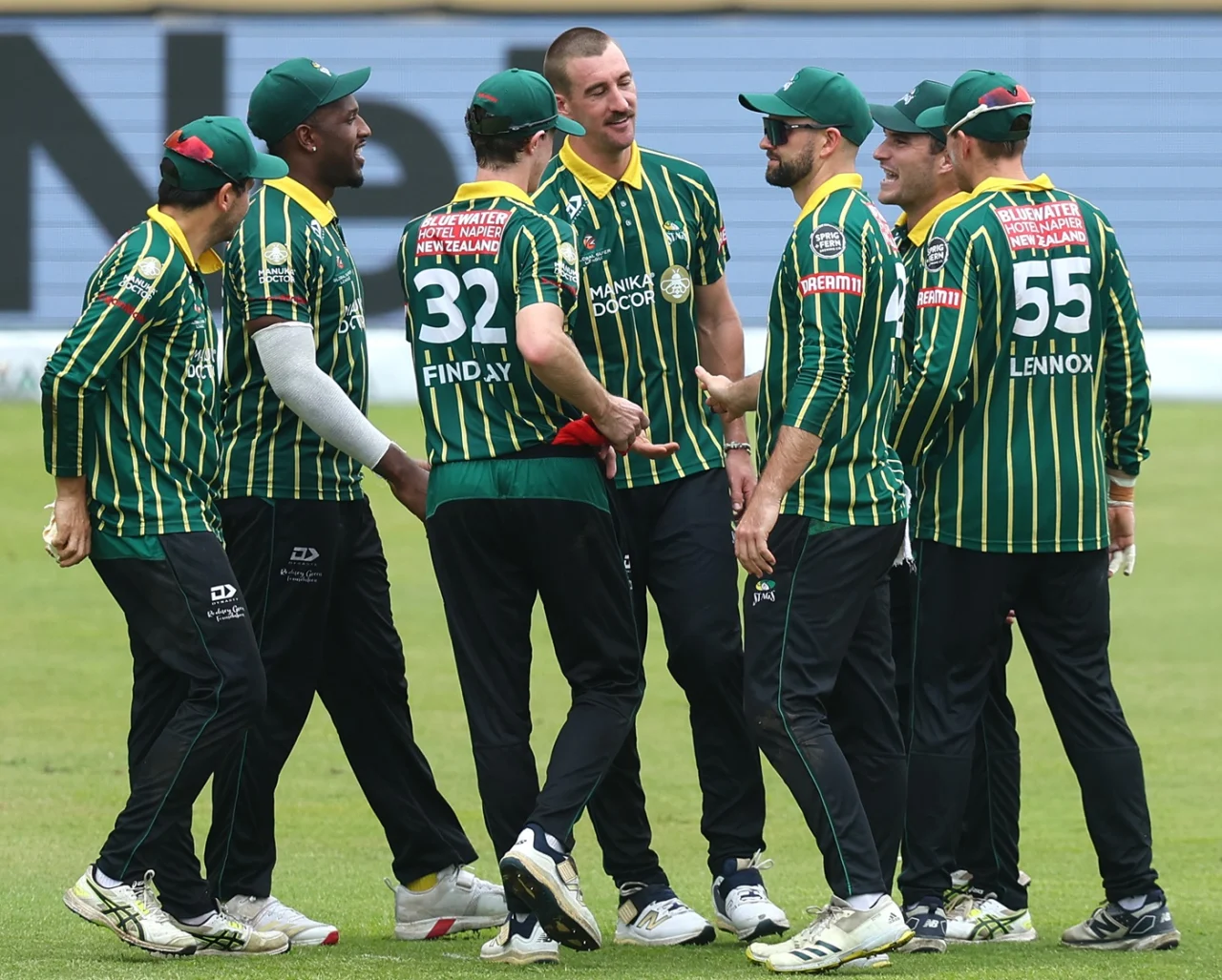 Blair Tickner of Central Districts, celebrates with his teammates 